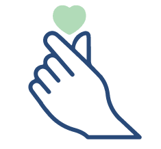 Hand making a heart shape with finger and a little heart on top.